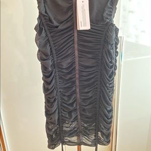 Guess black ruffled skirt with adjustable strings for the length. new, size XS